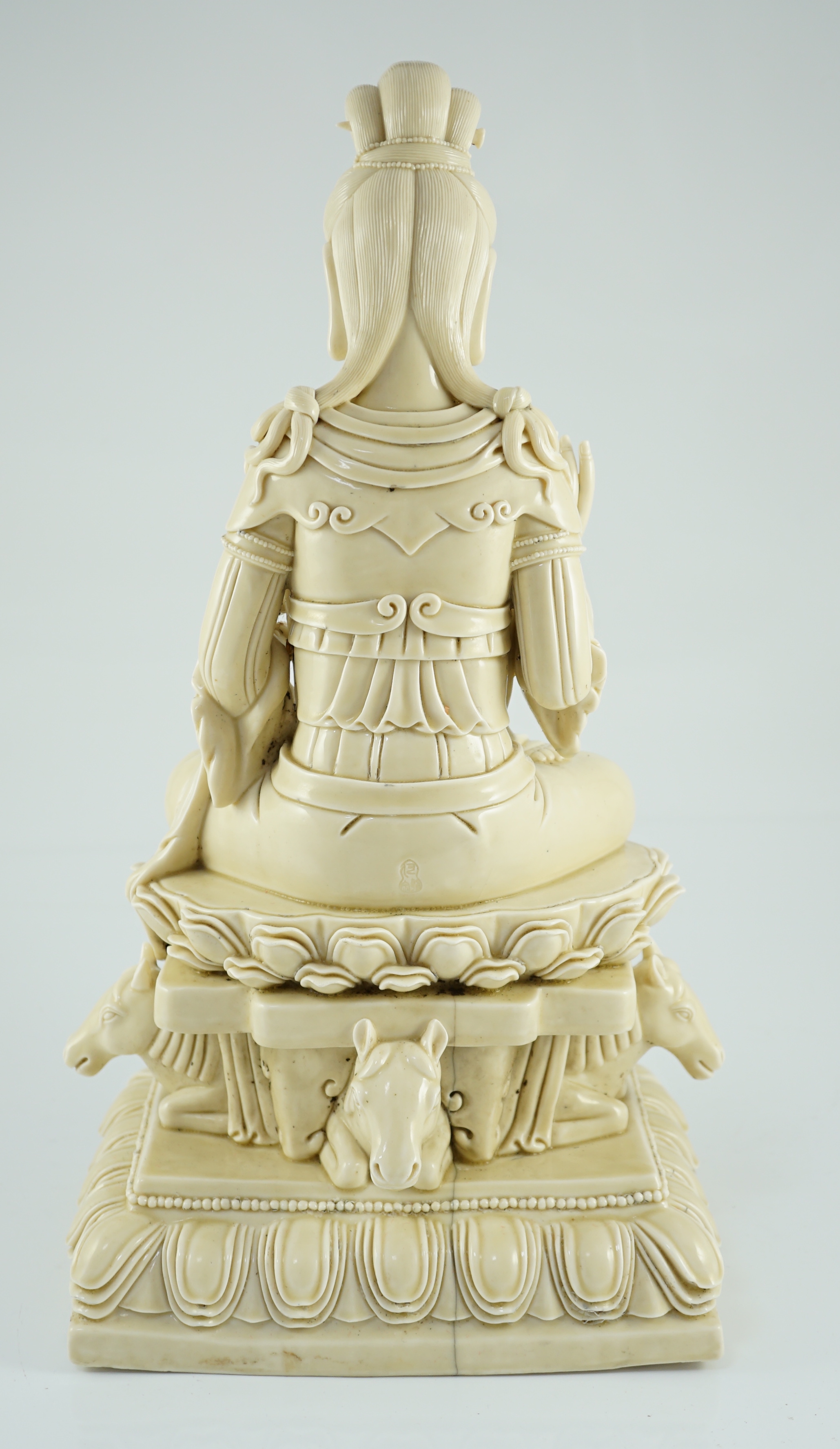 A large Chinese Dehua blanc de chine figure of Guanyin, Republic period, He Chaozong mark within a double gourd